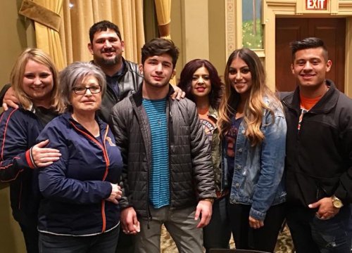 Two-time NCCA wrestling champion Isaiah Martinez with friends after his defeat in the 165-pound final Saturday in Cleveland. Joining him were Carlotta Martinez, Yvonne Martinez-Garcia, Angel Robles, Anhisa Zavala, and Marcio and Valerie Botelho.